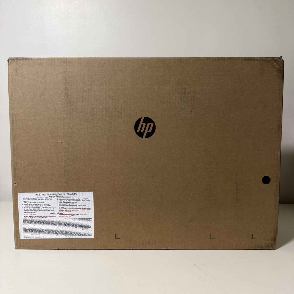 HP 27-cr0054 all-in-one carton front with HP logo and product label