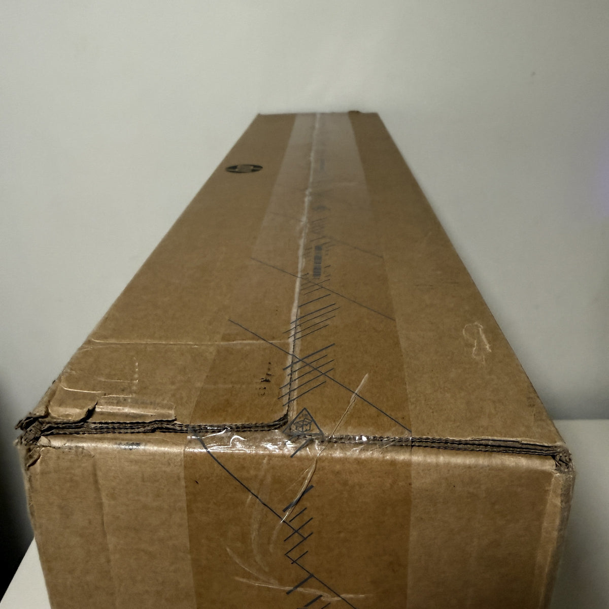 Scuffed and frayed corners and edges on the HP all-in-one carton