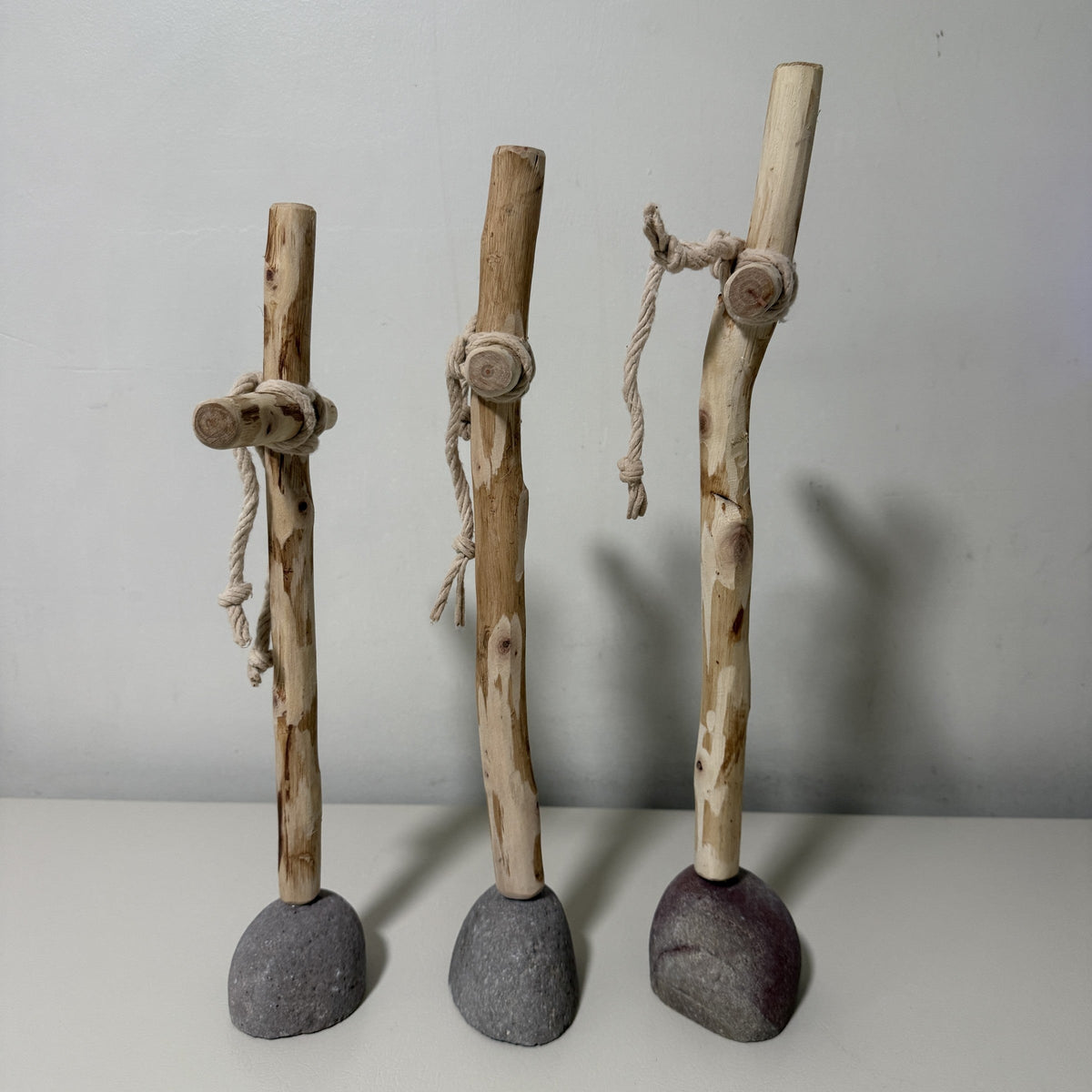 Side profile of the three wood crosses showing the natural curve of each branch