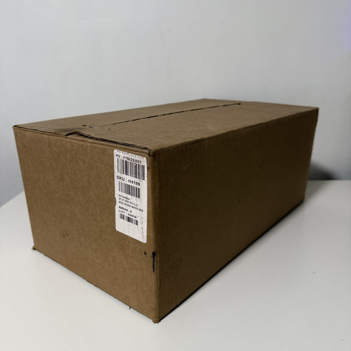 Shipping carton for the set of three wood crosses, angled view