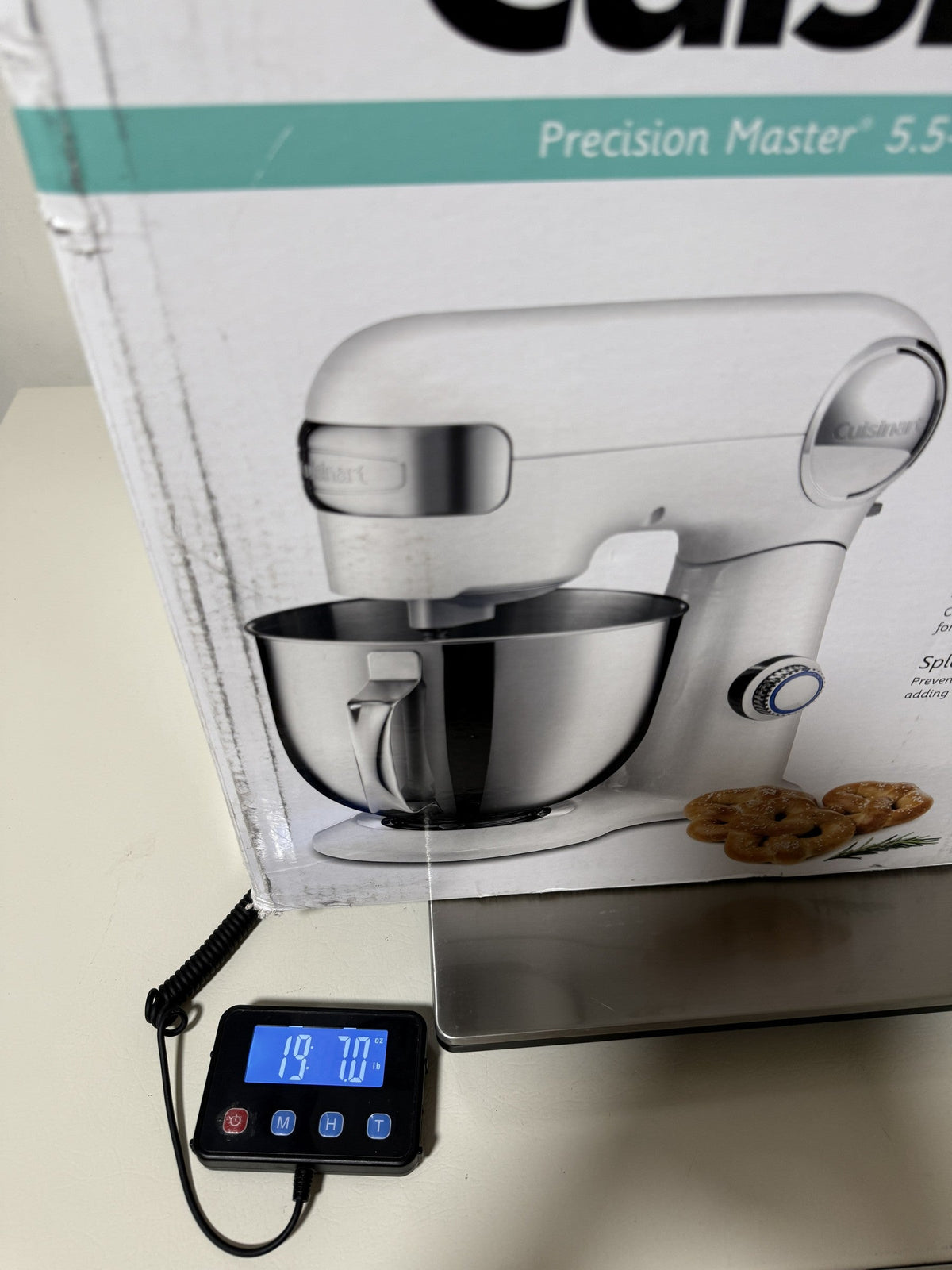 Cuisinart SM-50 box on a digital scale reading 19 lb 7.0 oz