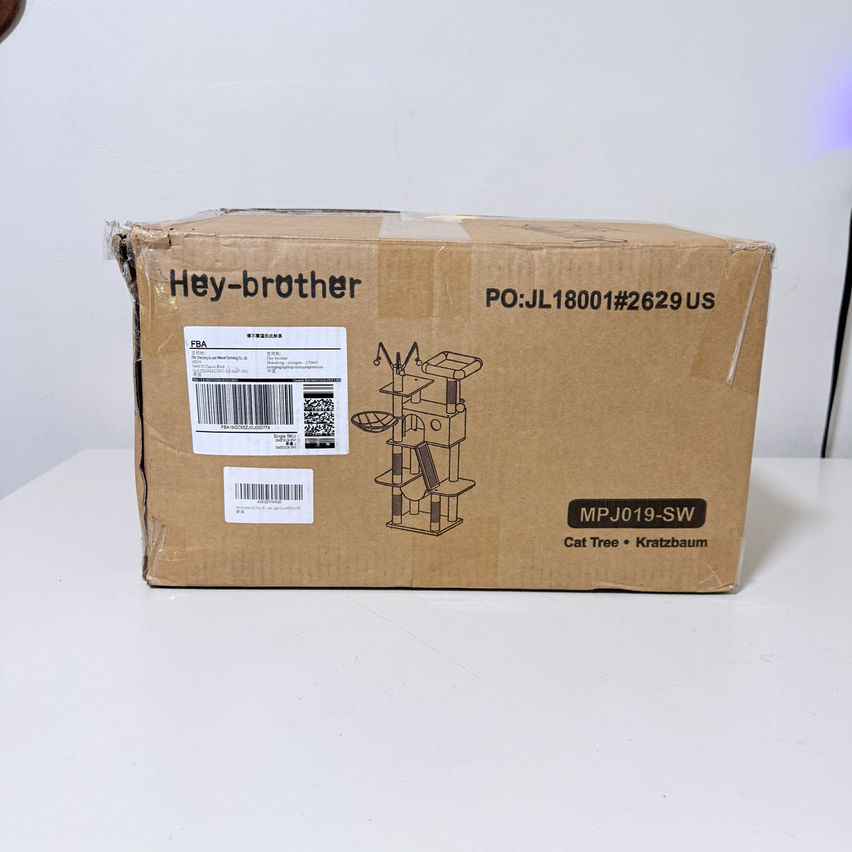Hey-brother cat tree carton side panel with model MPJ019-SW and shipping labels