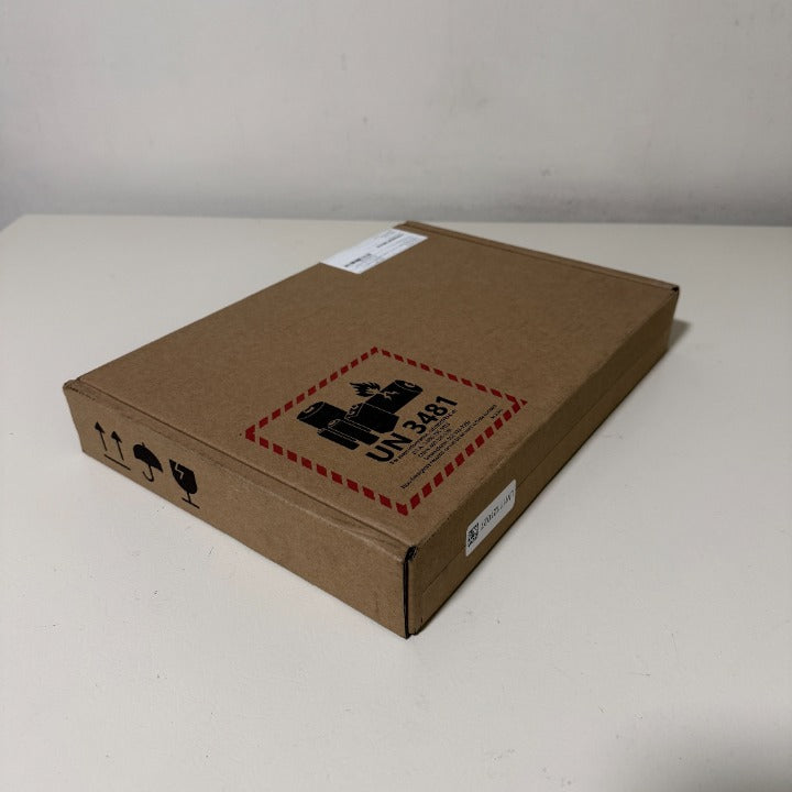 Sealed Microsoft Surface Pro retail carton showing the factory unseal pull tab